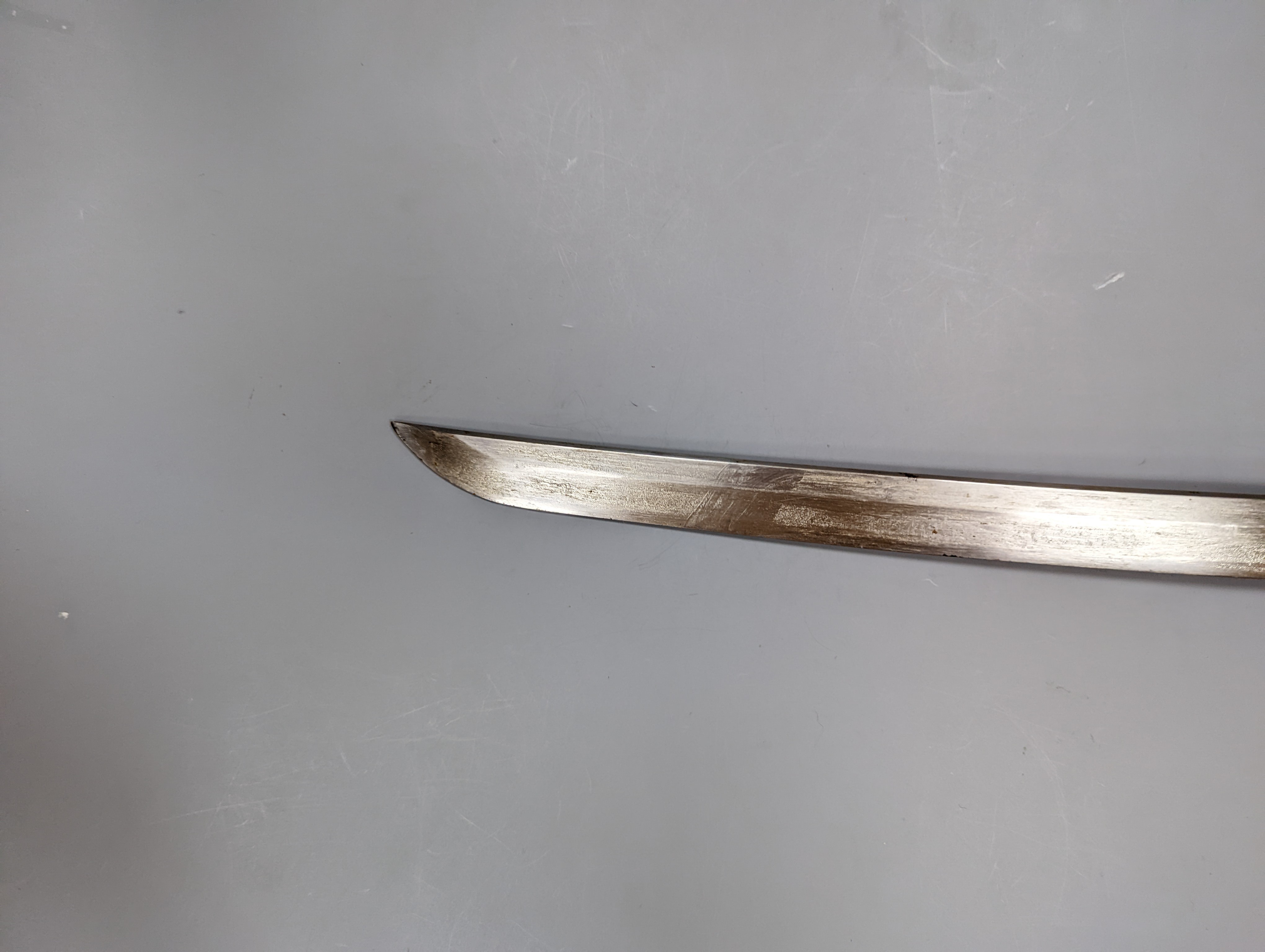 A Japanese Katana with leather covered sheath, plaque reading ‘Presented to Capt. S. Mear Telecoms B.M.A’ 93 cms long.
